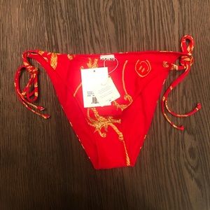 Brand new. Still in packaging with tags. Ganni string bikini bottom, size 8-10